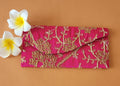 pink color embroidered envelope