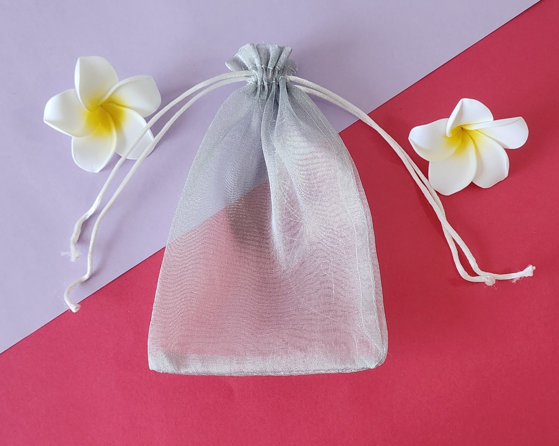 Transparent Potli Pouch with flowers around it
