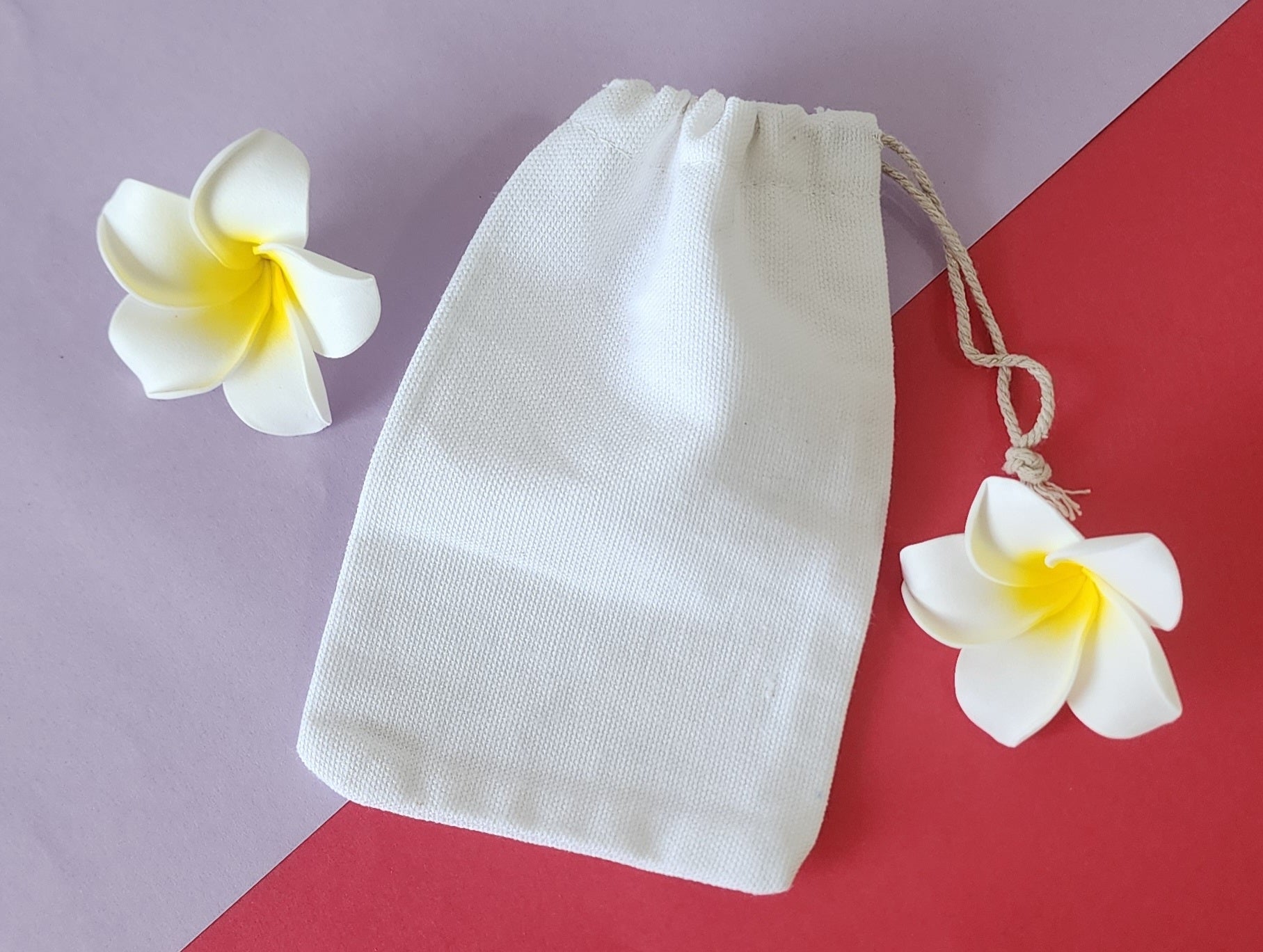 Potli bag in plain color white with flowers