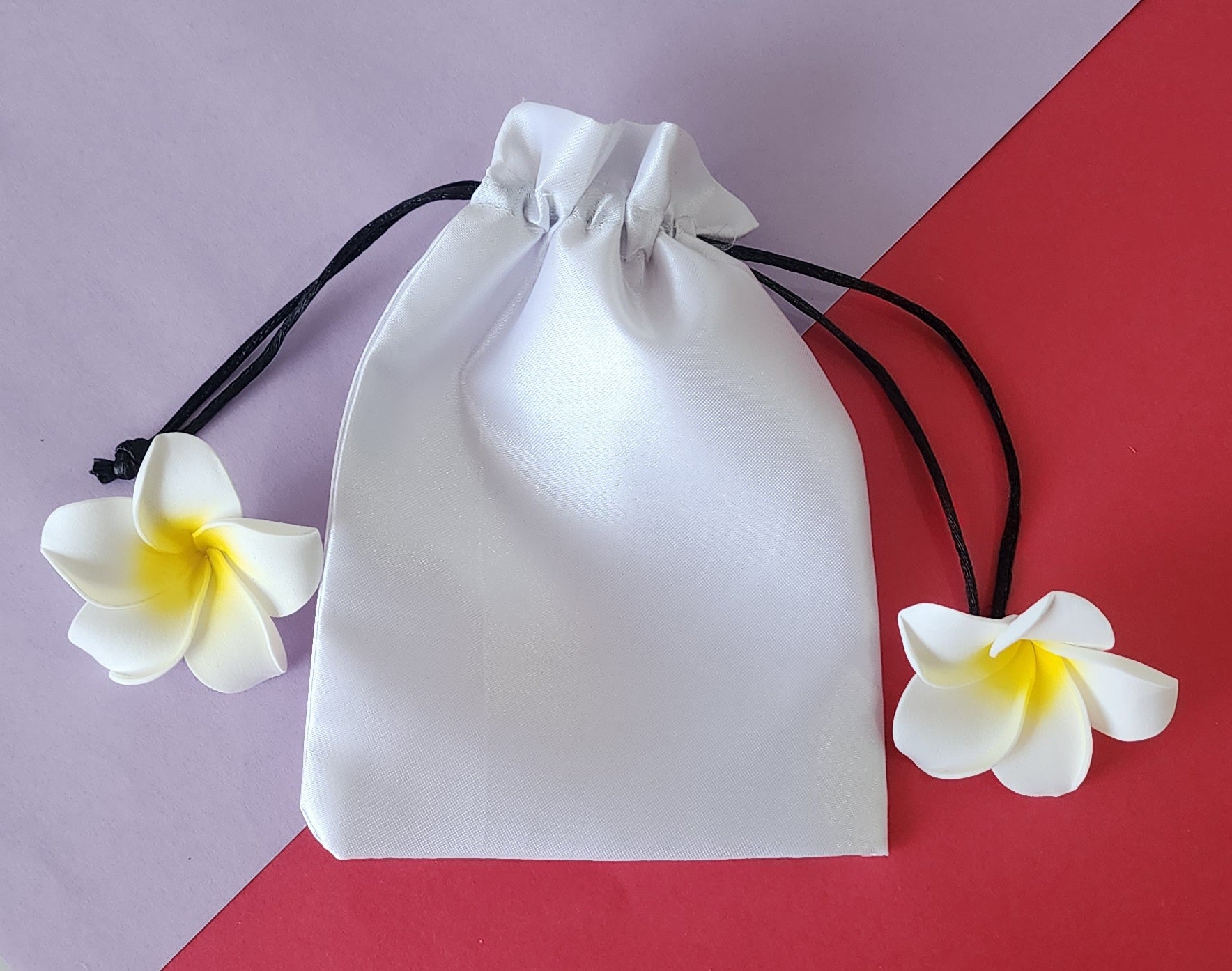 Potli bag in plain white color with black rassi