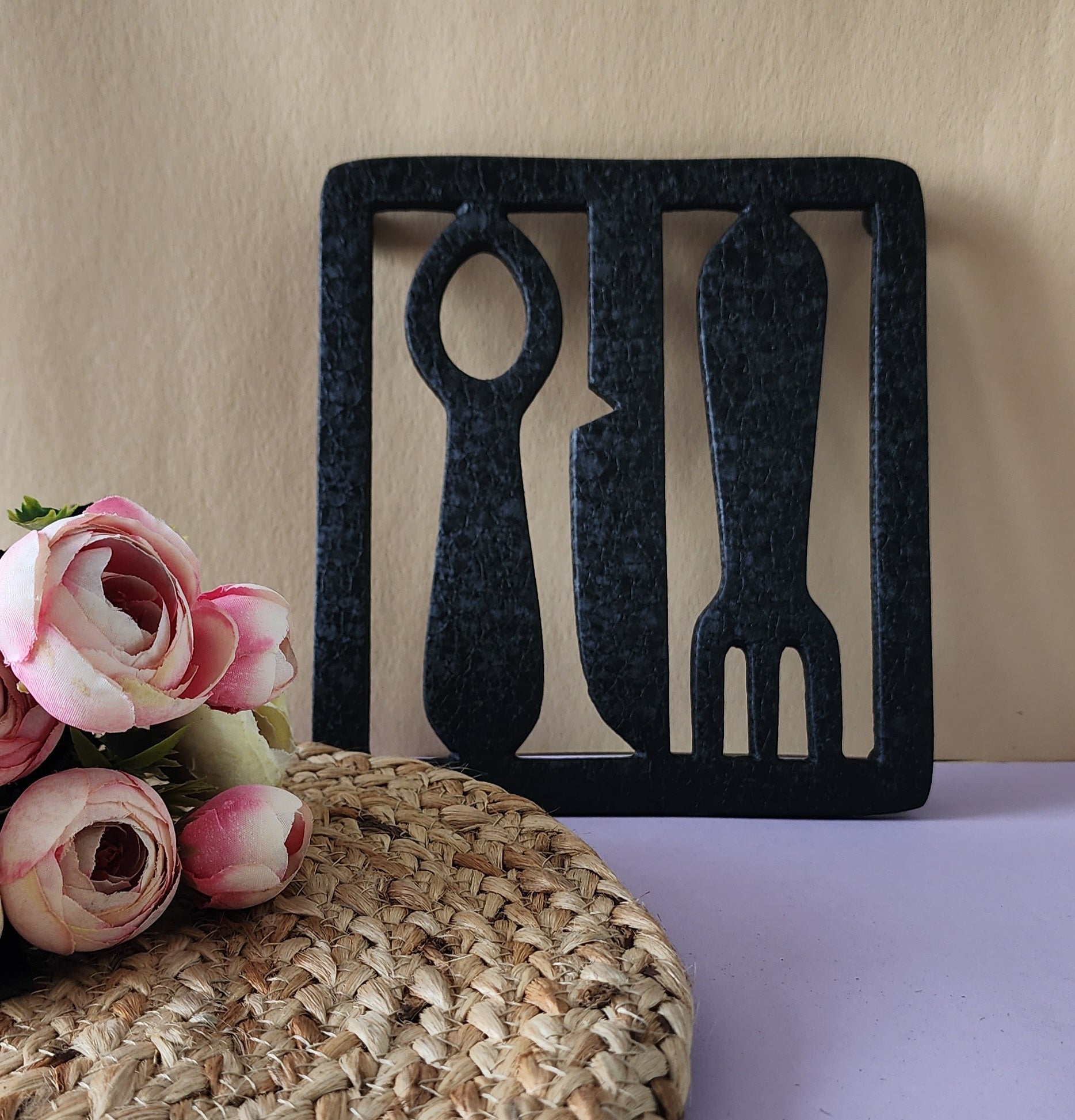 Black Aluminum Fork and Knife Trivet woth flowers