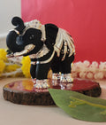 black and silver Elephant on wooden base for Vastu