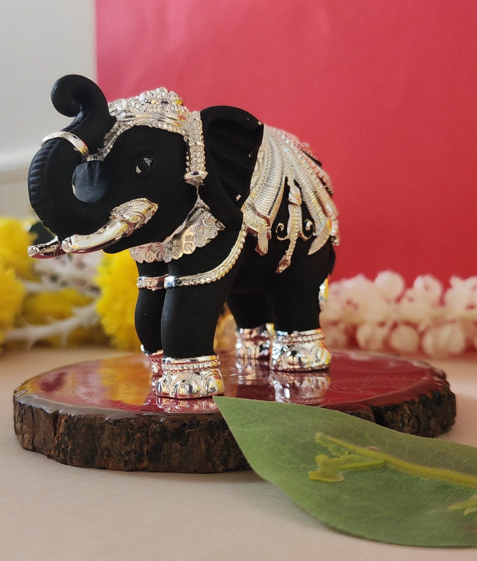 black and silver Elephant on wooden base for Vastu