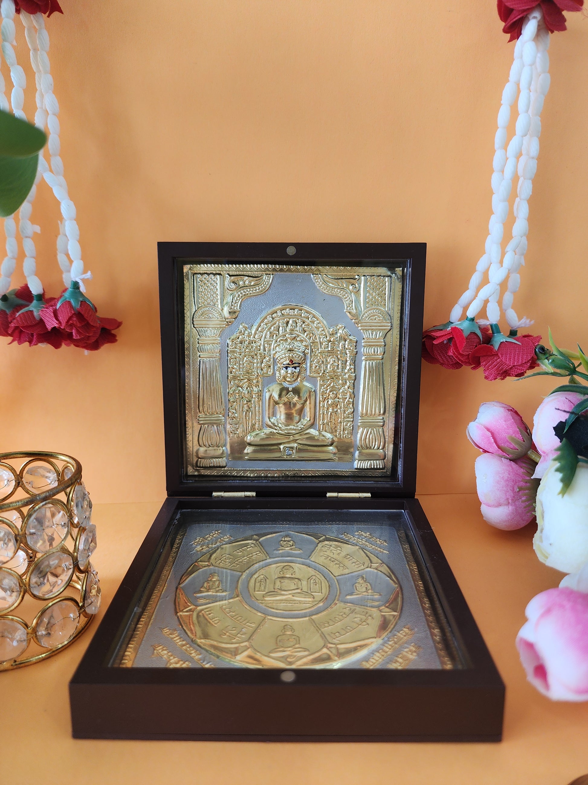 golden Lord Mahavir Pocket Temple with flowers and with red rose on white mala
