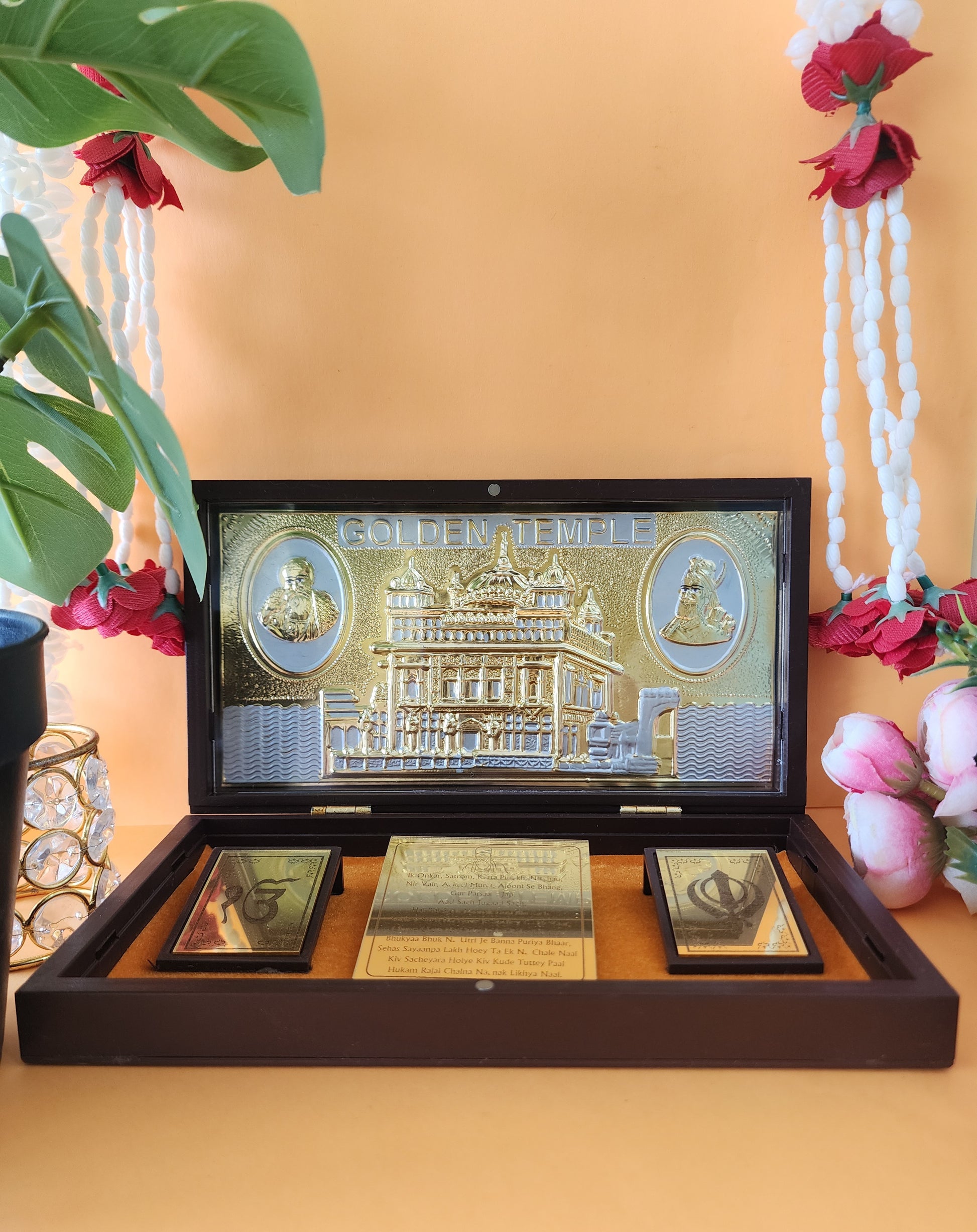 open wooden Golden Temple Pocket Temple  with white mala around it