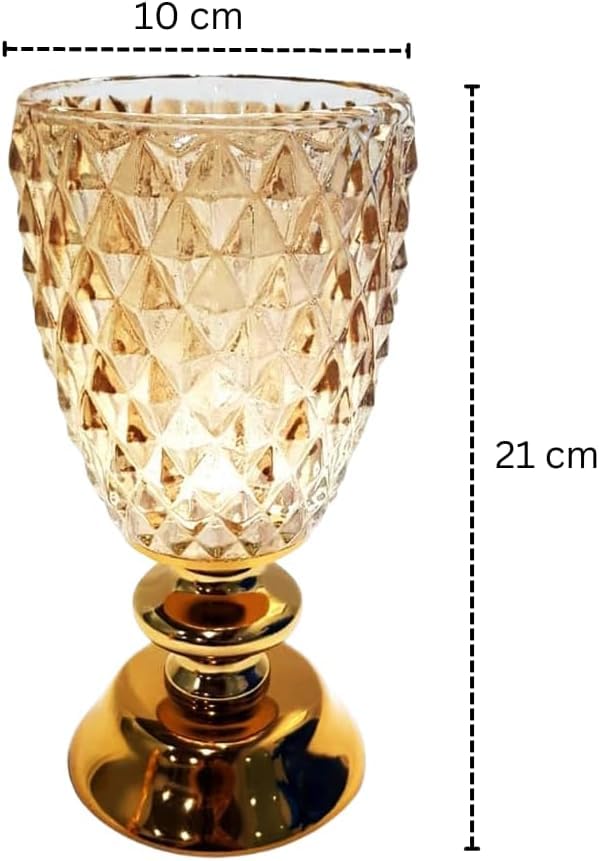 A close-up shot of a textured glass hurricane candle holder on a glossy, golden metallic base.