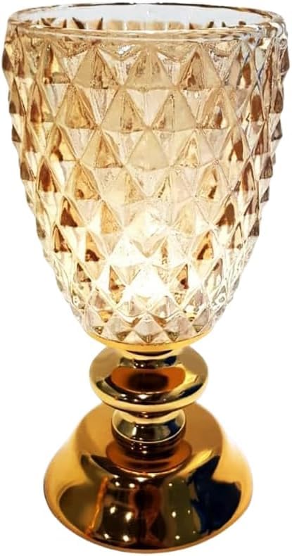 A close-up shot of a textured glass hurricane candle holder on a glossy, golden metallic base.