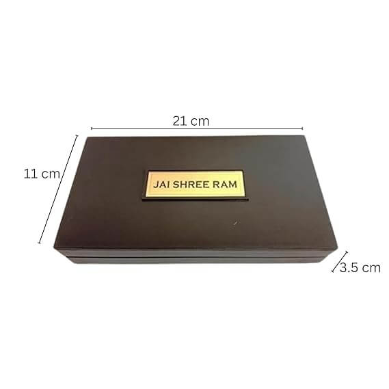 A rectangular, dark brown box with a golden plaque on top that reads "JAI SHREE RAM," with dimensions labeled as 21 cm (length), 11 cm (width), and 3.5 cm (height), representing a Ram Darbar pocket temple box.