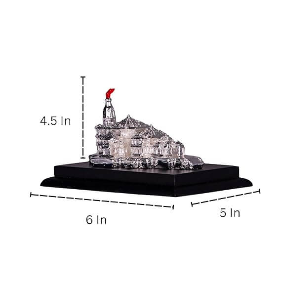 A silver-colored miniature idol of the Ayodhya Ram Mandir, featuring intricate details of the temple architecture and a red flag at the top. The idol rests on a dark rectangular base, with dimensions indicated around it: 4.5 inches in height, 6 inches in length, and 5 inches in width.