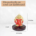 A Red-colored Ganesha idol on a dark brown circular base, with the brand name