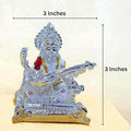 Silver-plated idol of Goddess Saraswati playing the Veena, measuring 3 inches in height and width.