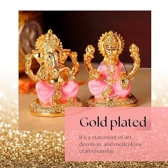 Gold plated Lakshmi and Ganesha idols on a pink and gold glitter background. Text reads: Gold plated. It's a statement of art, devotion, and meticulous craftsmanship.