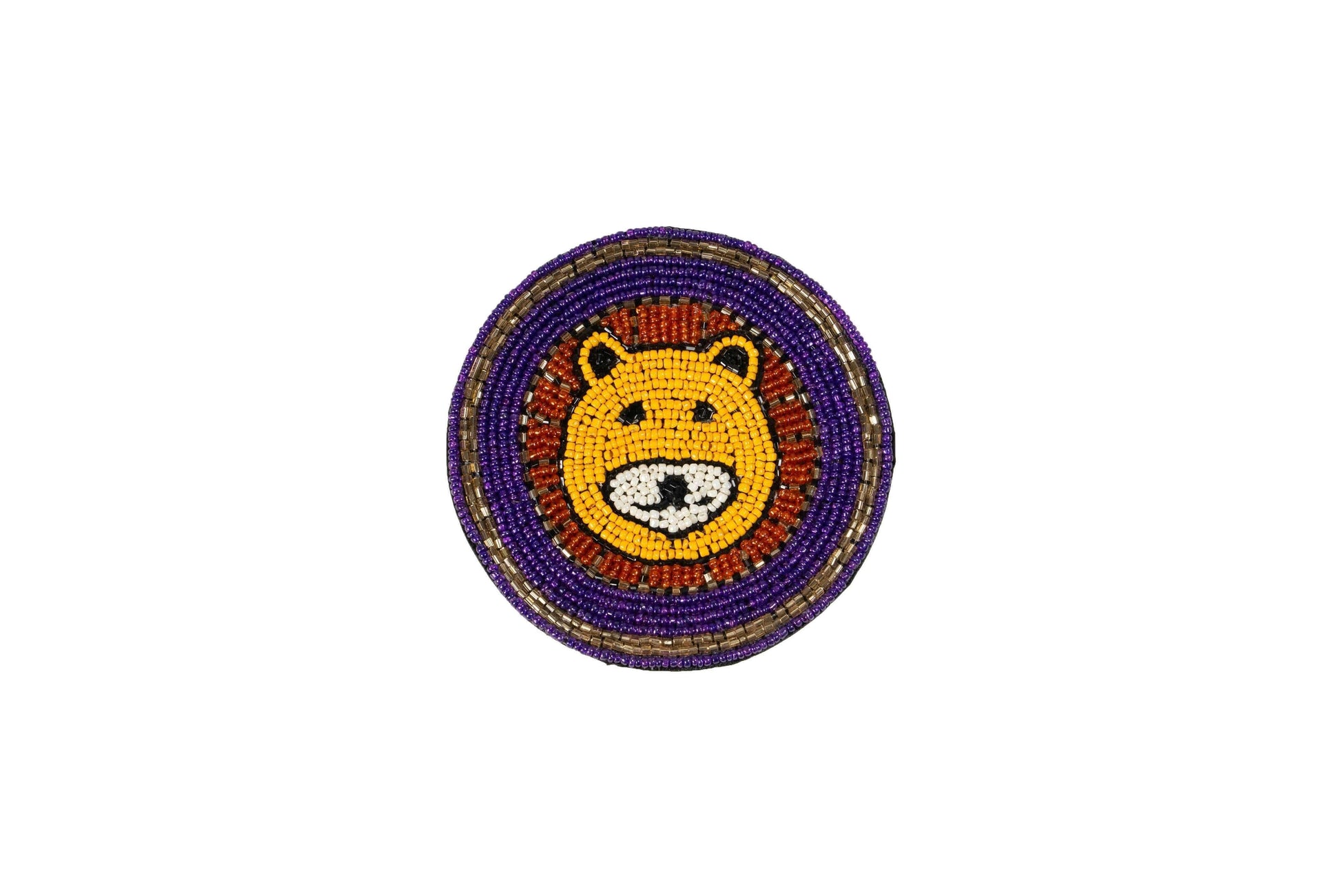 A single round Beaded Coasters - Safari Theme coaster featuring a yellow and white beaded lion's face with a red and orange mane. The outer edge of the coaster is decorated with concentric rings of purple and gold beads against a white background.
