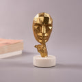 single Antique Face Figurine with finger on lips