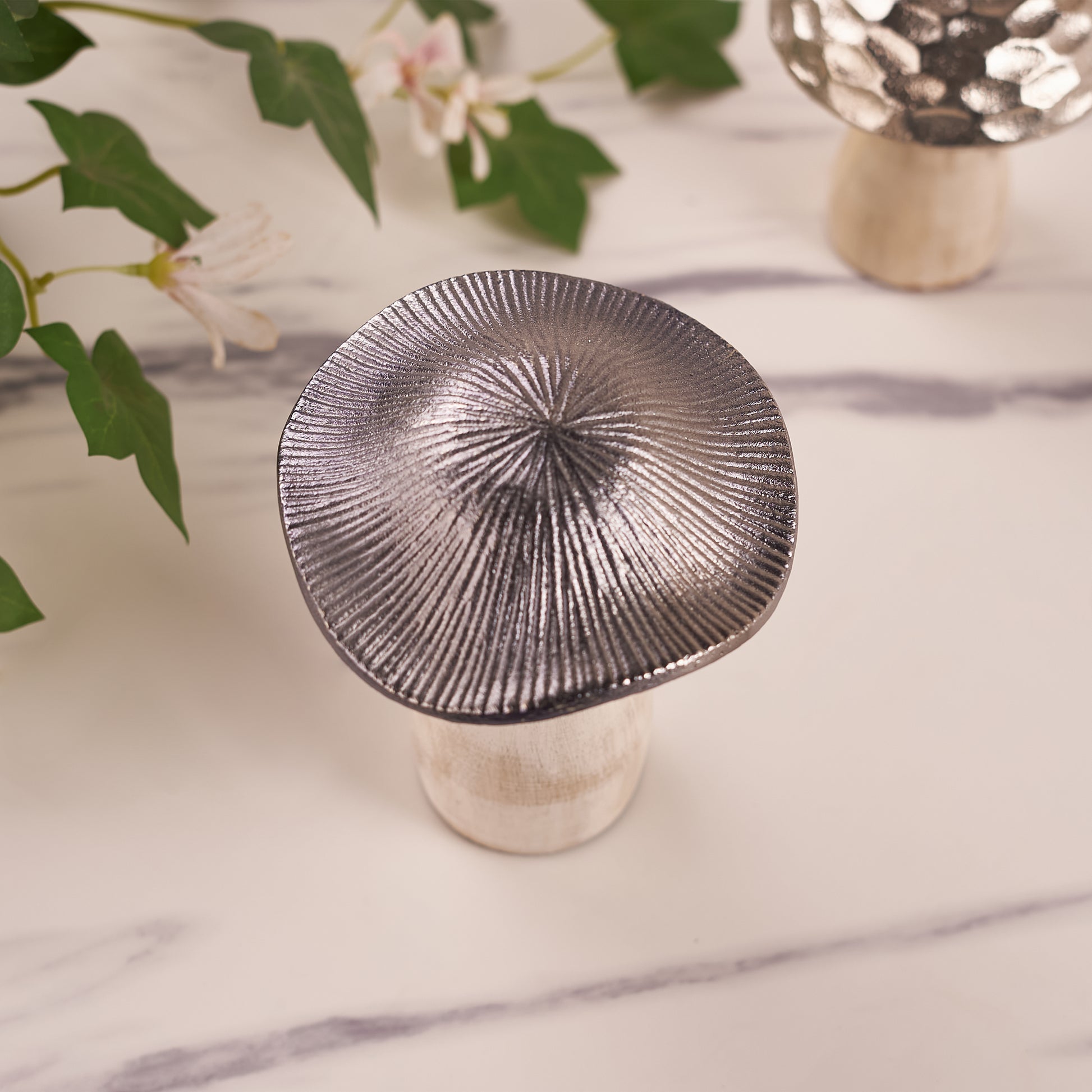 A silver mushroom-shaped decorative metal upper angel Photo