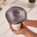 A silver mushroom-shaped decorative metal top angel photo