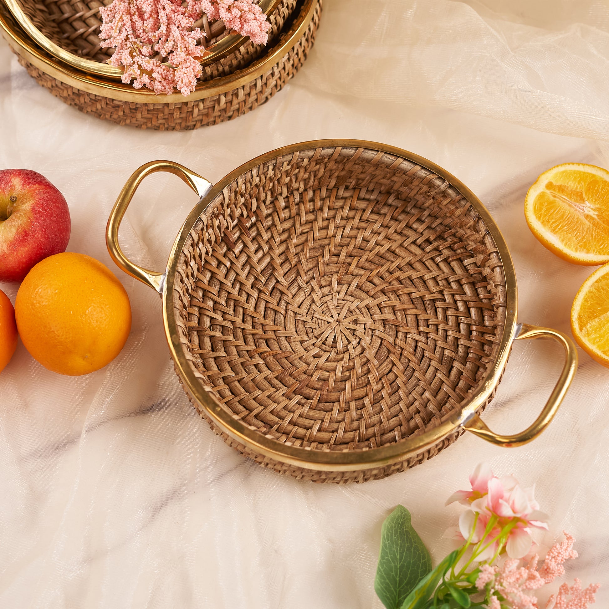 Rattan Tray with Handle with apple and oranges around it