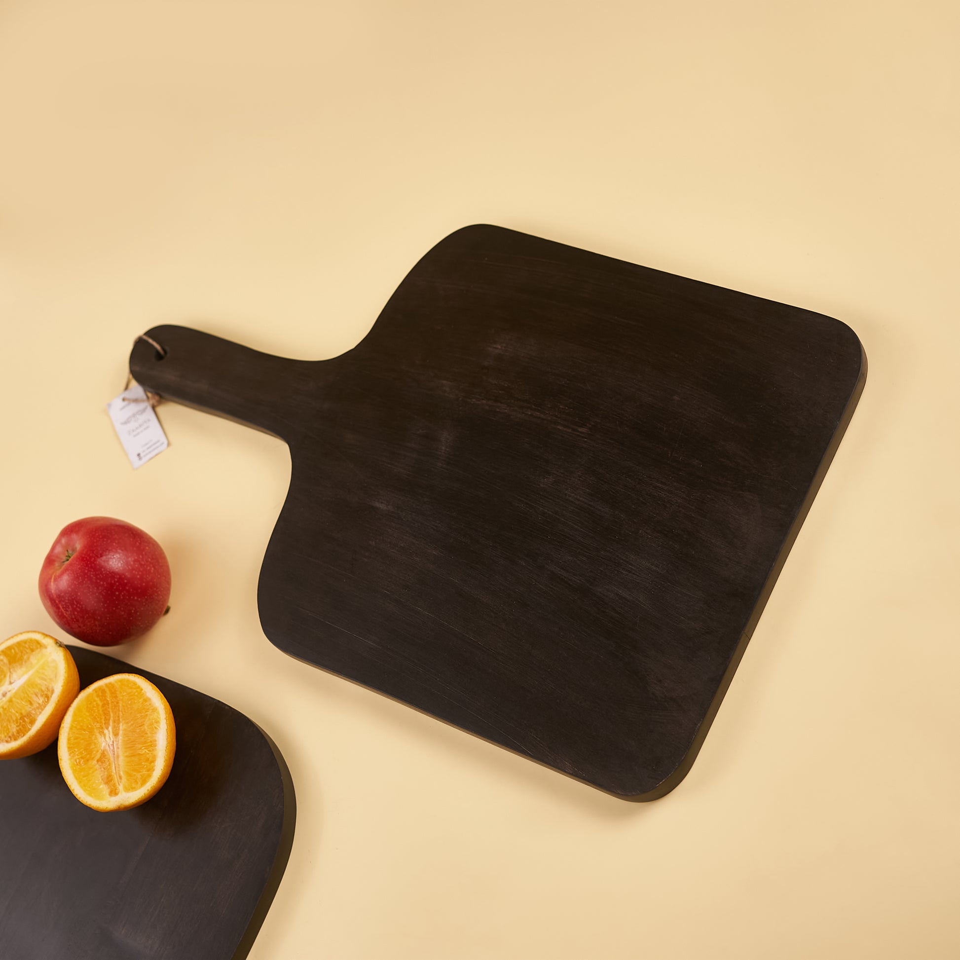Black Wooden Platter with fruits around it