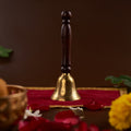 Brass Bell with Wooden Handle standing up straight