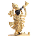 A gold-plated idol of Lord Shreenath Ji, a form of Krishna, featuring a black face and intricate golden attire, holding a conch shell and standing on a decorative base.
