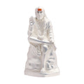 Silver-finished idol of Shirdi Sai Baba seated in a blessing posture with a serene expression, against a plain white background.