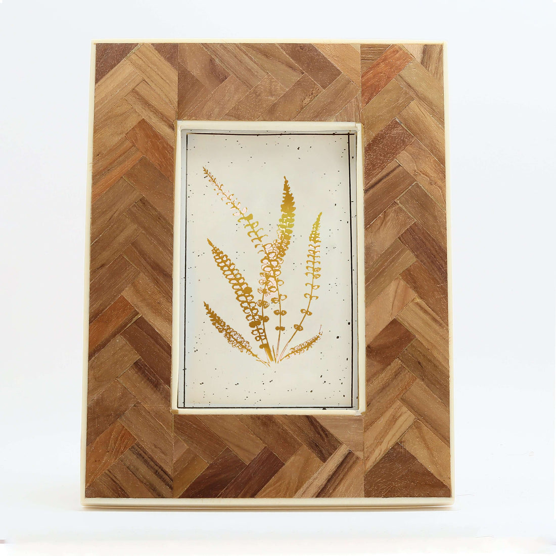A resin and teakwood frame placed on a wooden side table in a home setting, displaying an artwork or photo.