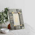 Grey and Gold frame on the desk