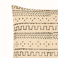 A 17.5in x 17.5in Tribal Design Cushion Cover featuring a beige background with black geometric patterns, including horizontal stripes of zig-zags, dotted lines, and arrow motifs.