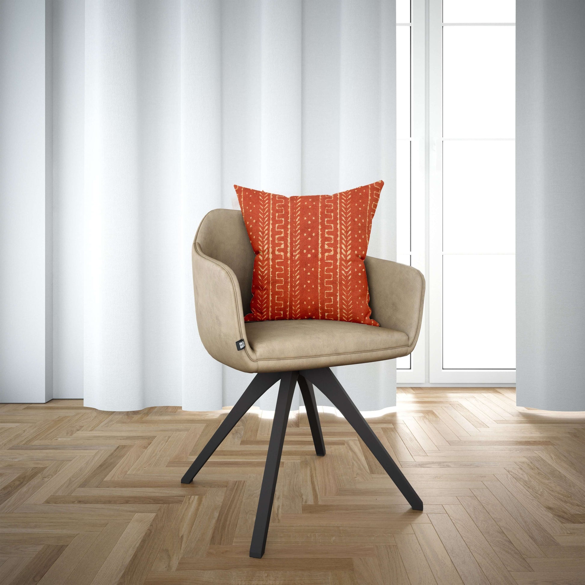 Rust Mudcloth Block Print Cushion Cover on the chair
