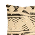 A beige and black tribal motif pillow cover