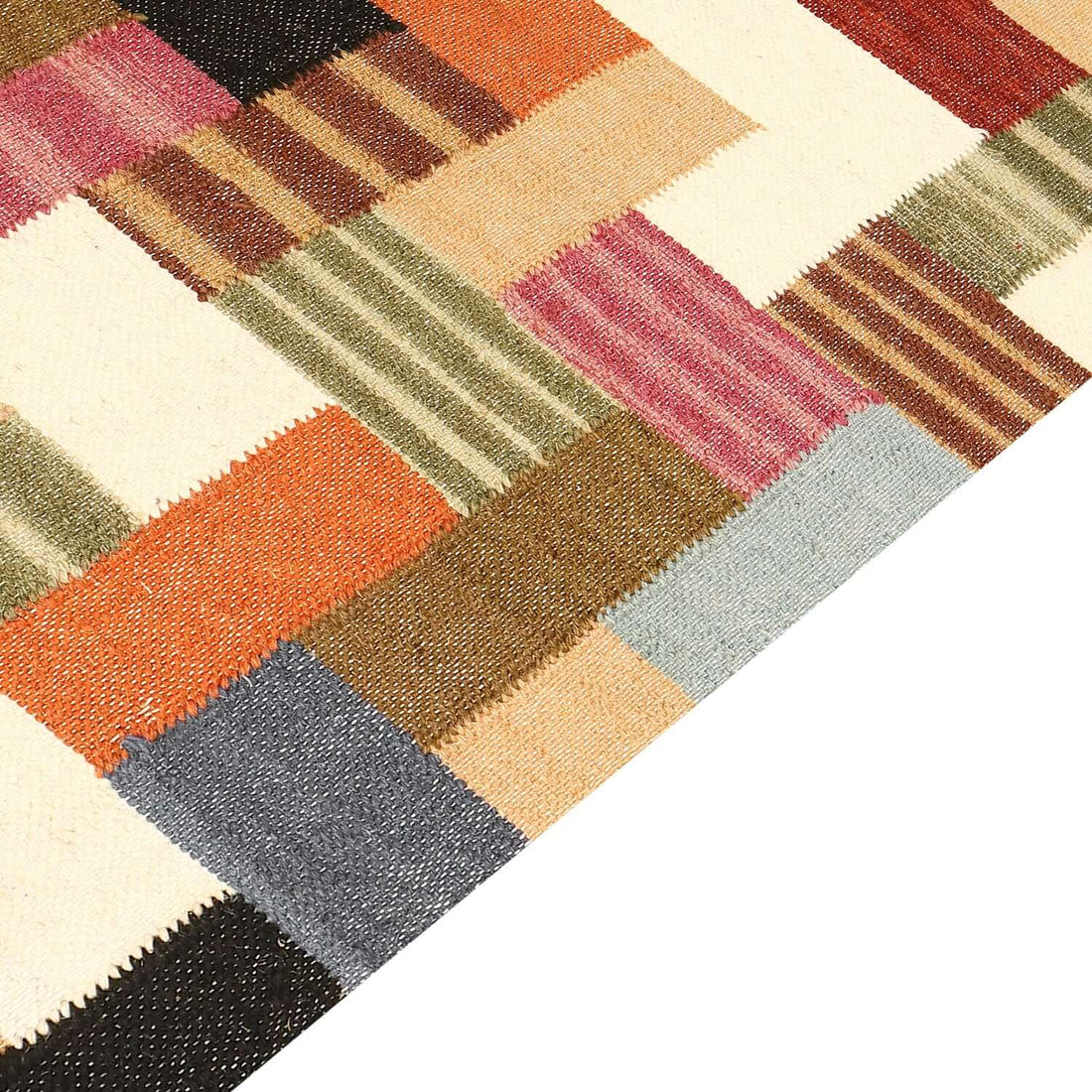 A rectangular multicolor block print rug with a vibrant pattern of various geometric shapes.