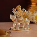 decorative silver and gold Maa Durga figurine mounted on a tiger
