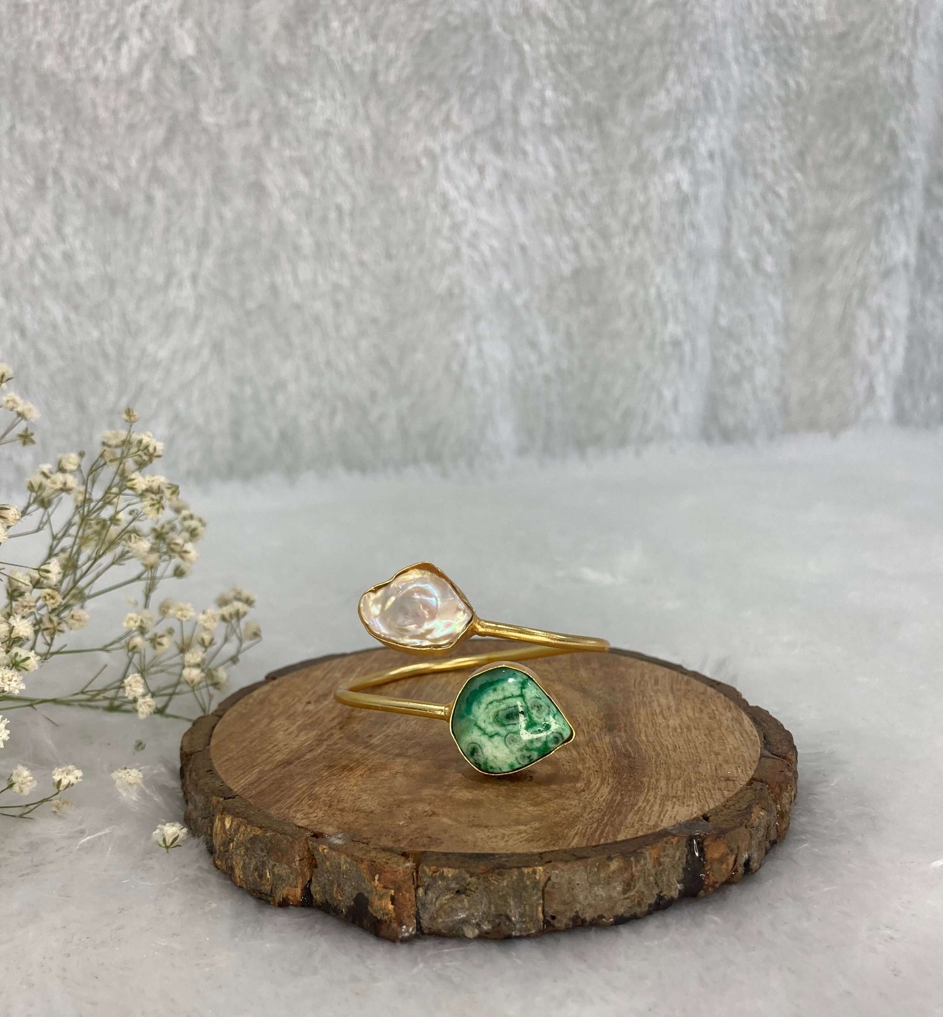2 stone Grren and silver design adjustable cuff on the wooden base