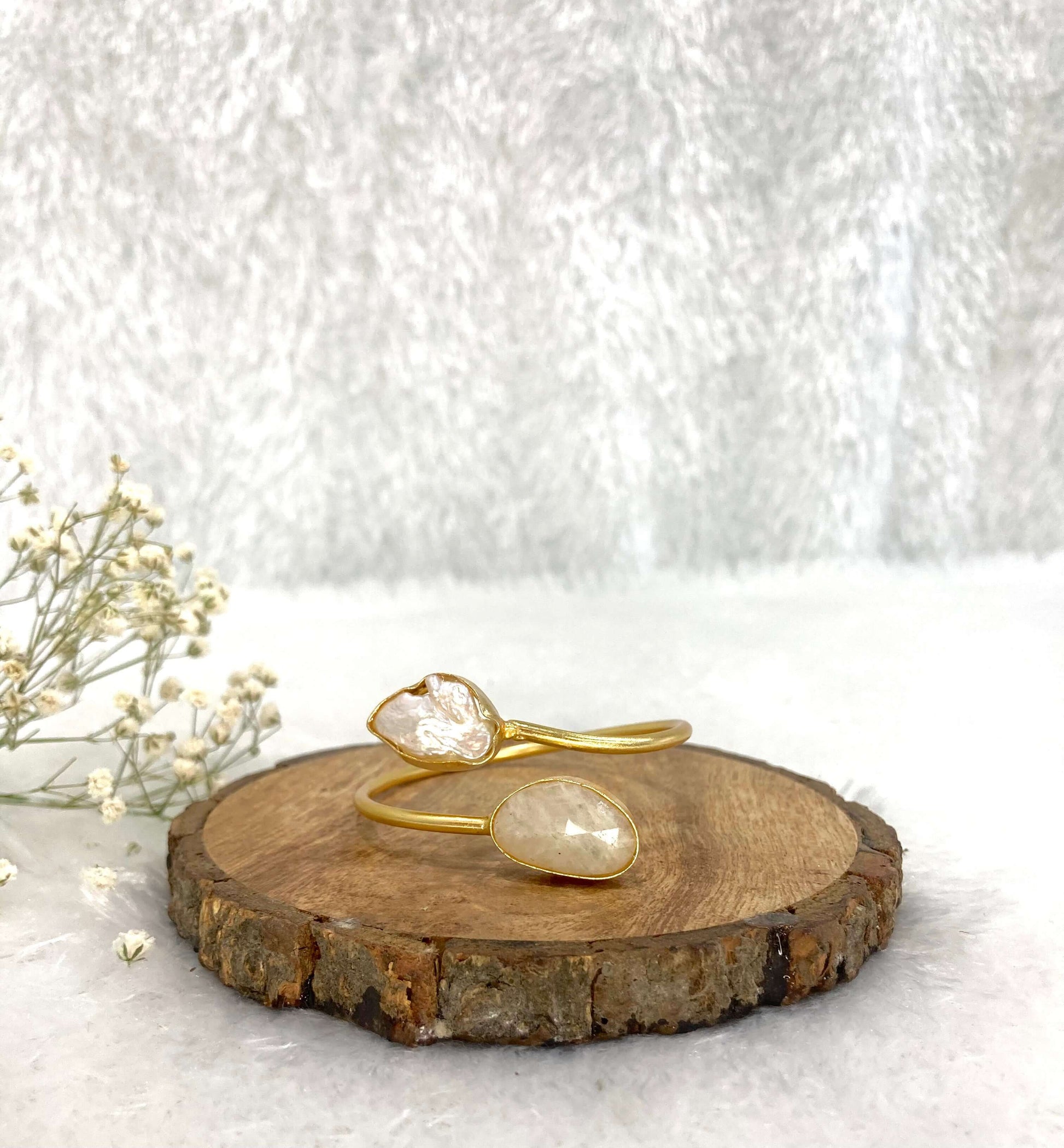 2 stone silver design adjustable cuff on the wooden base