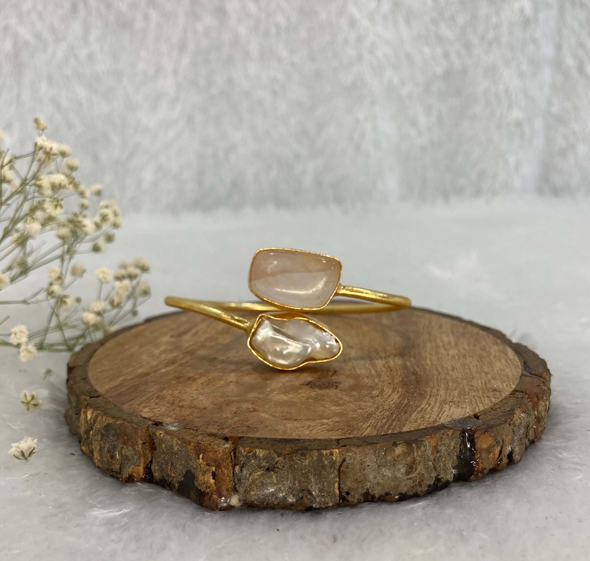 2 stone silver adjustable cuff on the wooden base