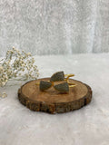 grey color Stone adjustable ear cuff on the wooden base