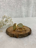 Water and wood color Stone ear cuff on the wooden base