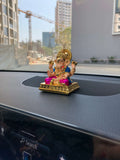 Dagdusheth Ganesh car Idol on the black color car dash dashboard, side angel photo