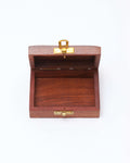 An open, handcrafted wooden jewelry box with a natural reddish-brown finish, shown from the front. The box is rectangular with a simple brass latch on the front and hinges on the back.