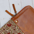 half lather laptop bag close up one side photo