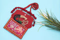Red design Handmade Embroidered purse with mala in it.