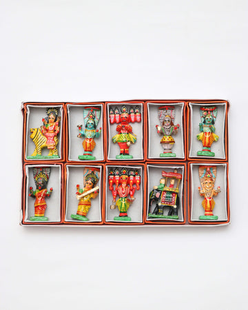 A set of ten handcrafted wooden statues of Hindu deities, displayed in a grid arrangement against a white background.