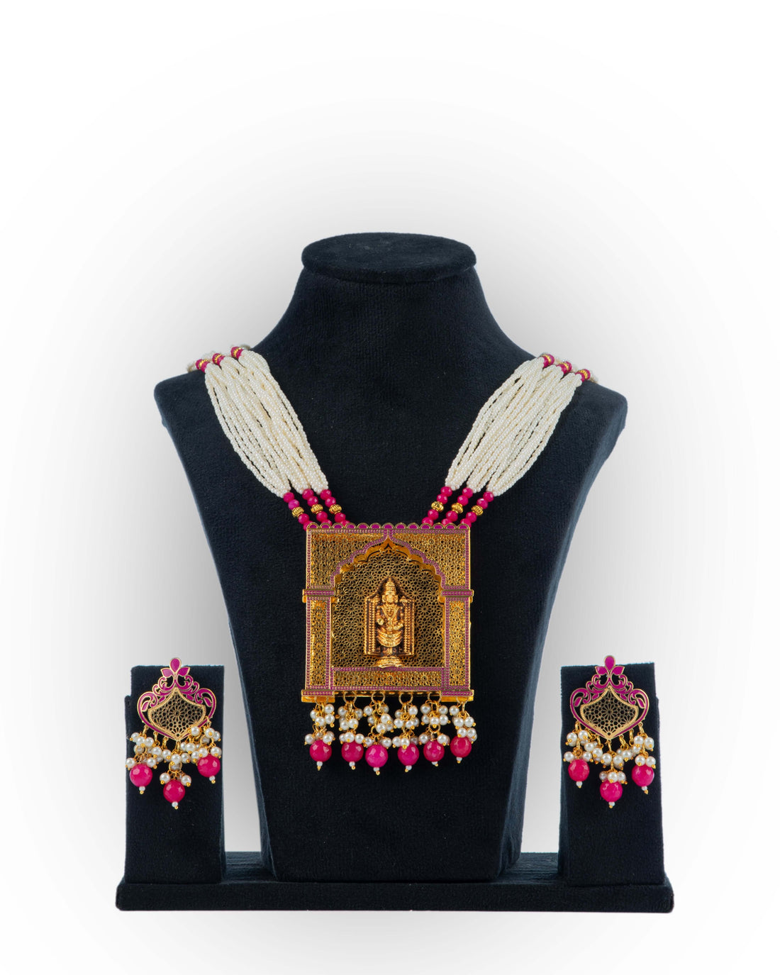 A jewelry set featuring a necklace with pink blossom pendants and a matching pair of earrings, displayed on a mannequin bust.