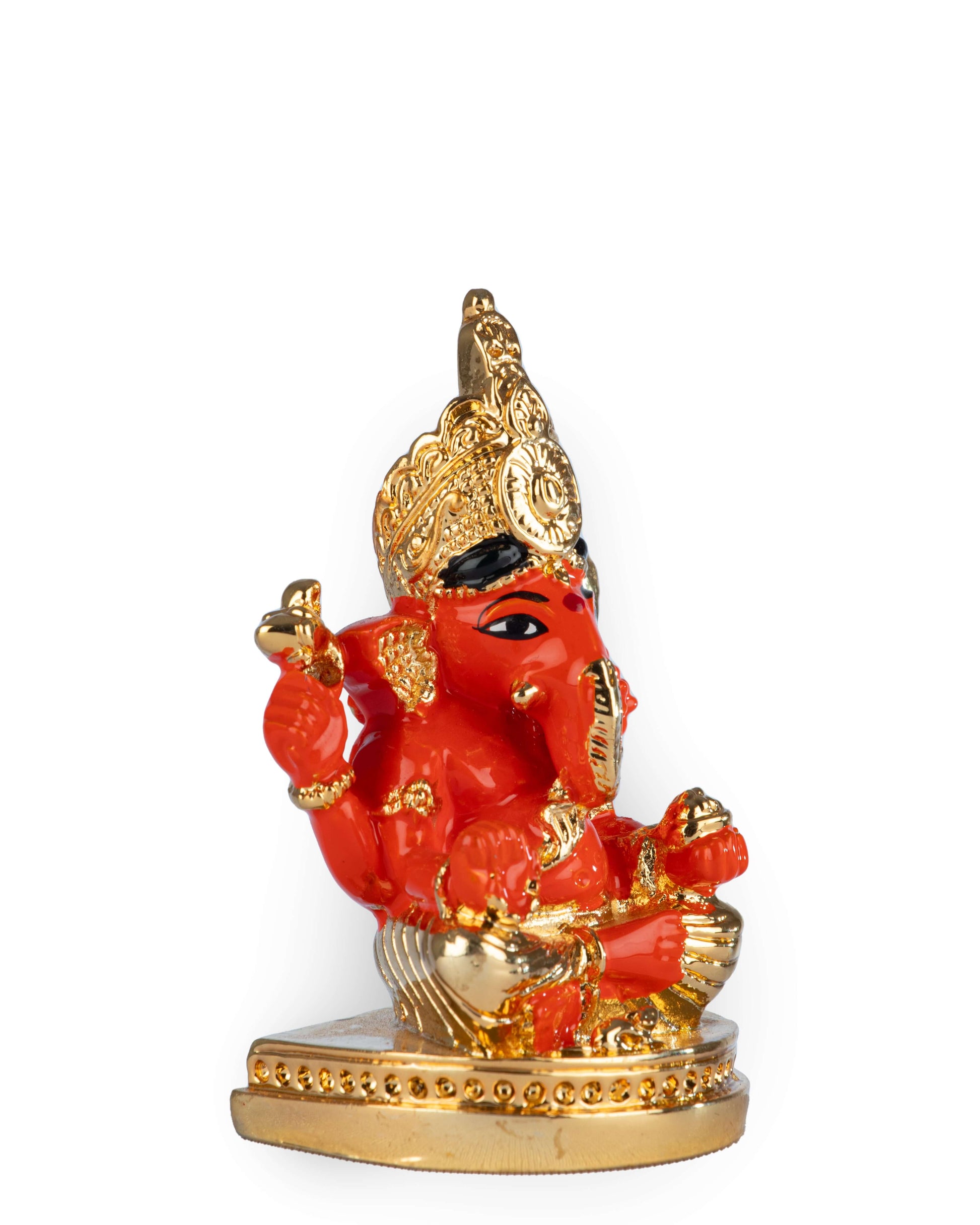 A red and gold statue of Lord Ganesha, specifically a Siddhivinayak idol, sitting on a golden base.