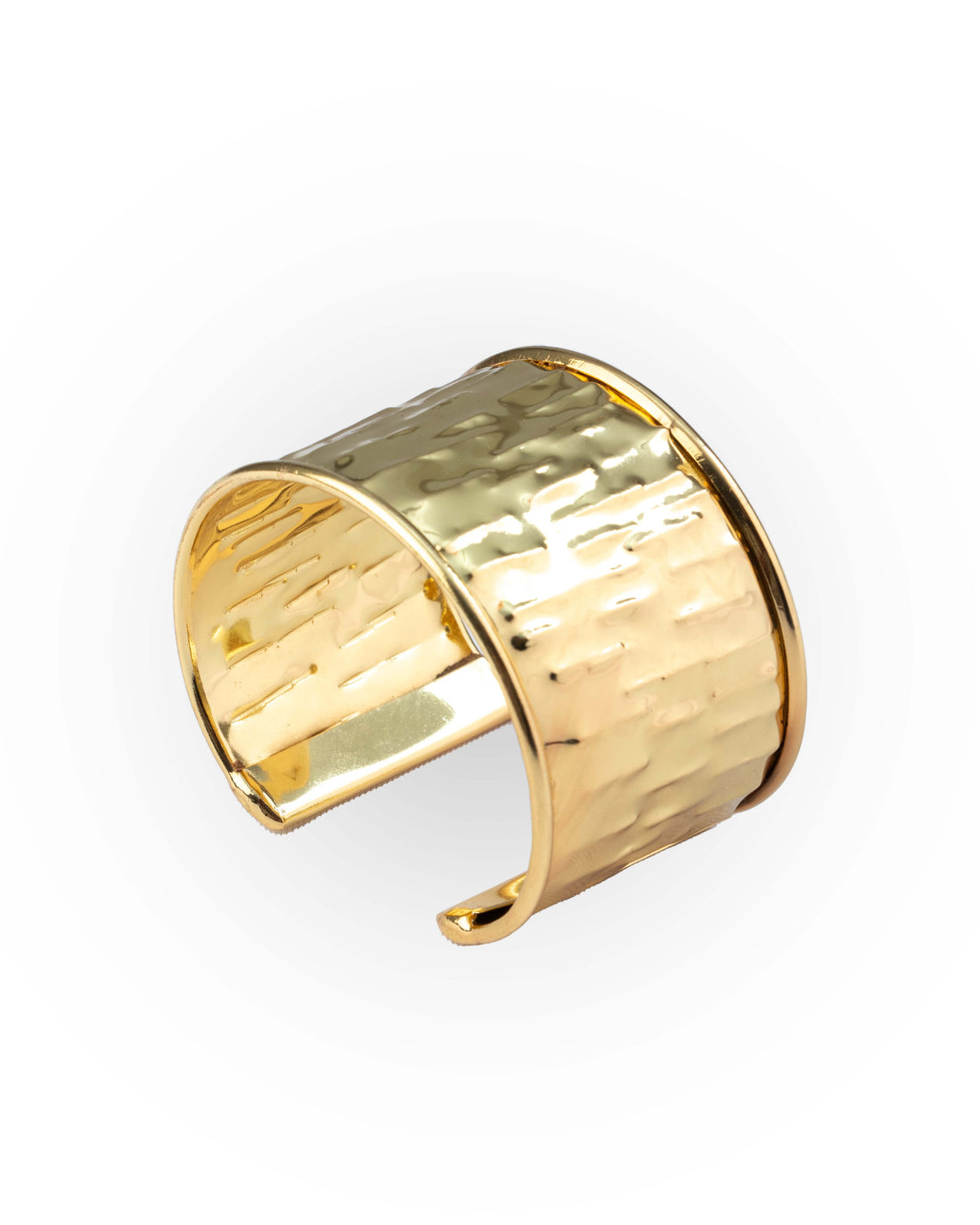 Gold cuff bracelet in hand