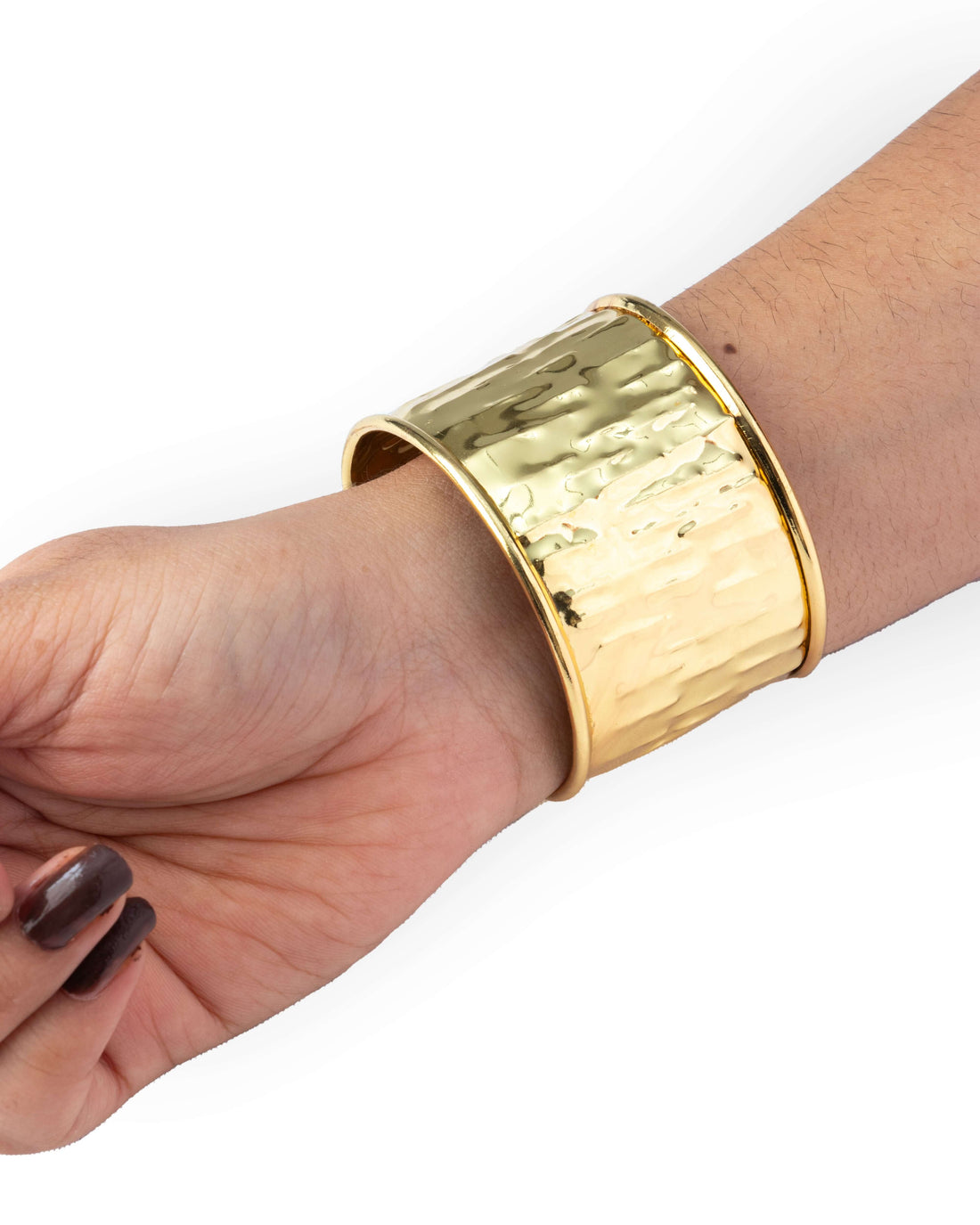 Gold cuff bracelet in hand