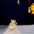 Gold Mushak Idol with laddu