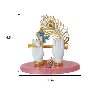 A gold-plated Lord Krishna Hands Idol featuring a peacock feather and a flute. The idol stands 4.5 inches tall and 5.0 inches wide at the base, with a hand span of 3.0 inches as indicated by dimension lines. It is set on a pink, oval-shaped base.