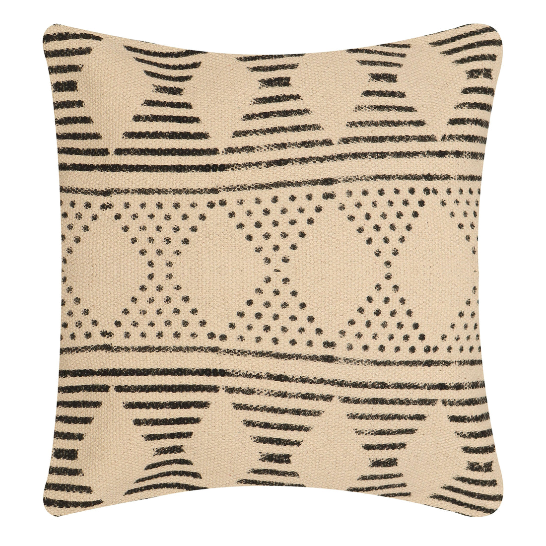A beige and black tribal motif pillow cover on a gray sofa.