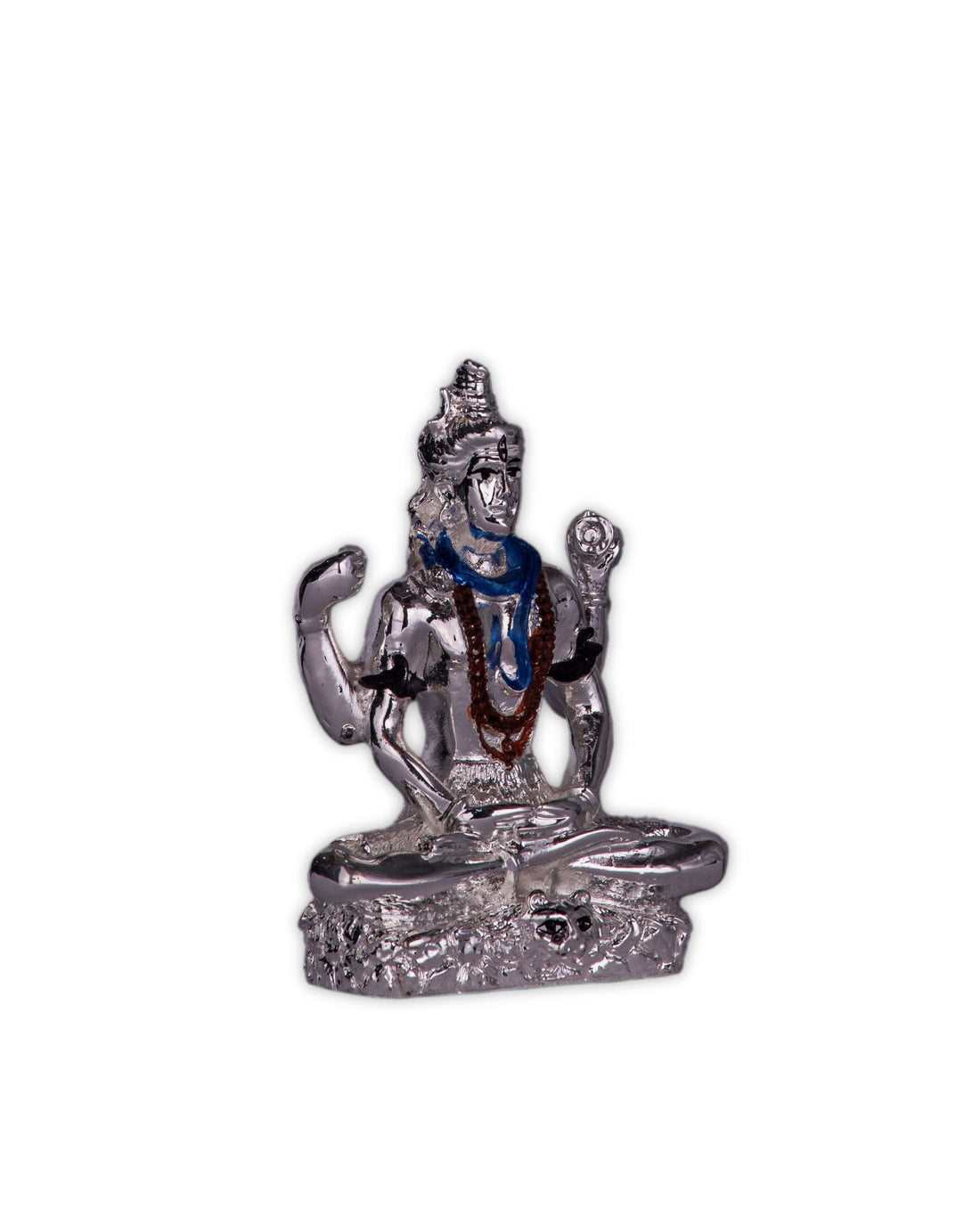 A silver-plated idol of Lord Shiva in a meditative pose, featuring a blue-painted throat and a mala around his neck, seated on a base decorated with yellow flower petals.
